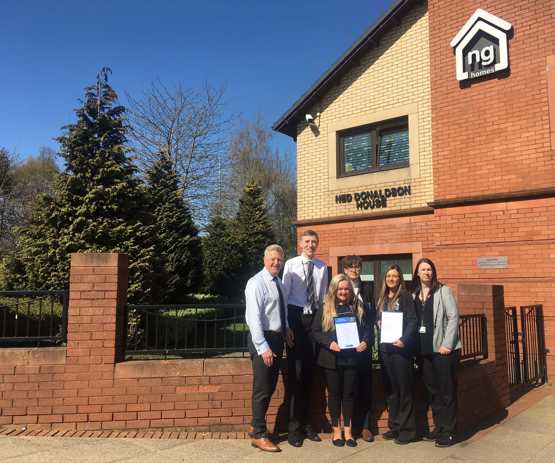 ng homes staff presenting Investors In Young People Gold Award